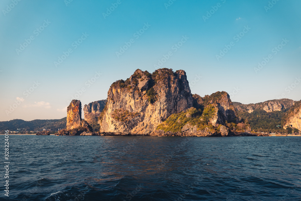 Blue sea and rocky mountains, evening bay in Krabi Blue sea and rocky mountains, evening bay in Krabi