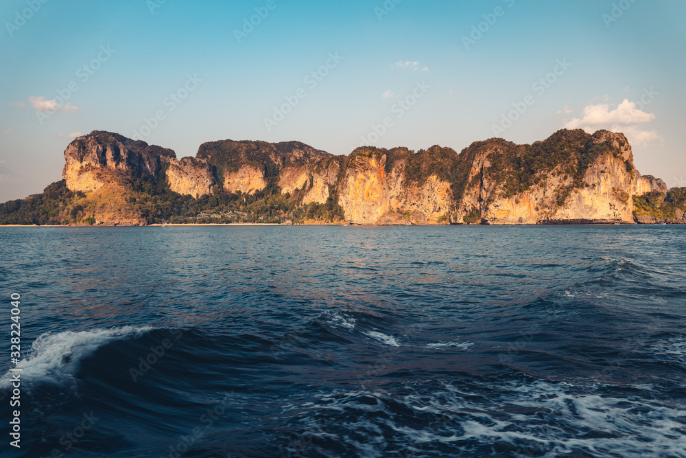 Blue sea and rocky mountains, evening bay in Krabi