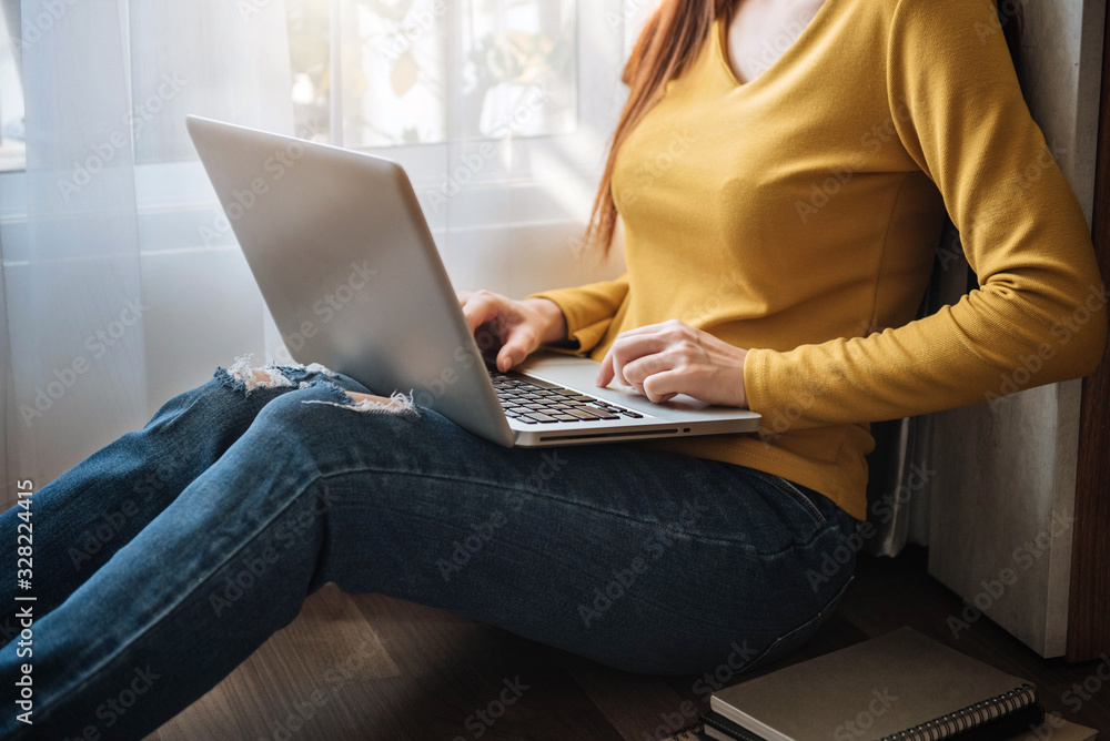 Naklejka premium Social media and virtual marketing including typing keyboard and laptop computer in the morning.