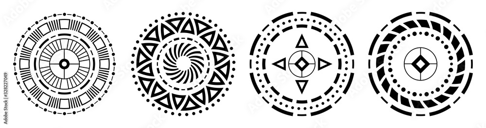 Set of four abstract circular ornaments. Decorative patterns isolated on white background. Tribal ethnic motifs. Stylized flowers. Stencil tattoo and prints. Vector monochrome illustration.