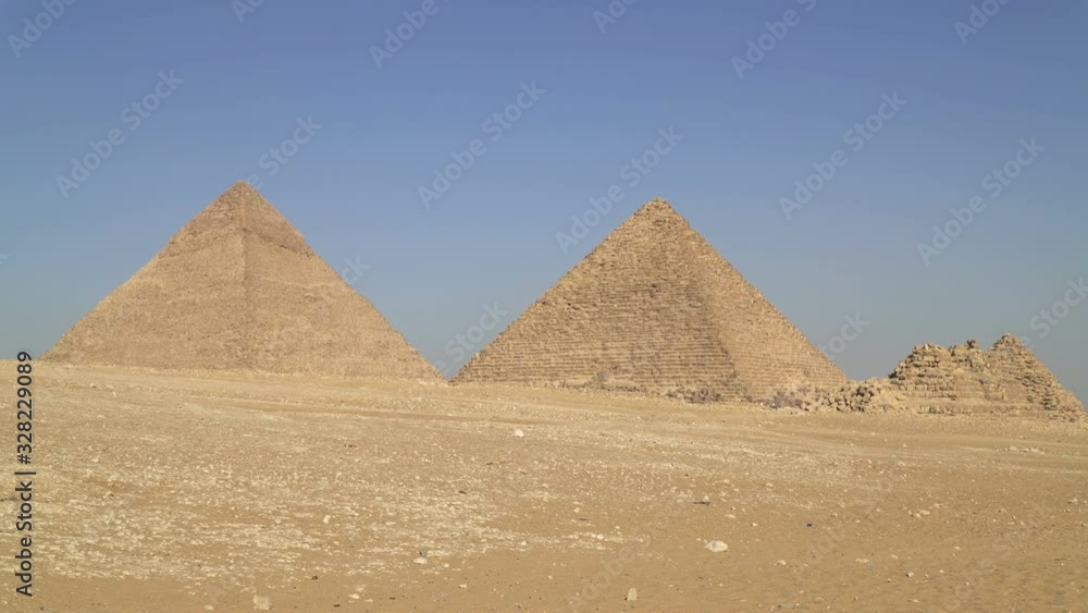 The Pyramid of Khafre and the Pyramid of Menkaure. Panoramic view of the Giza Plateau in greater Cairo, Egypt The Pyramid of Khafre and the Pyramid of Menkaure. Panoramic view of the Giza Plateau in greater Cairo, Egypt