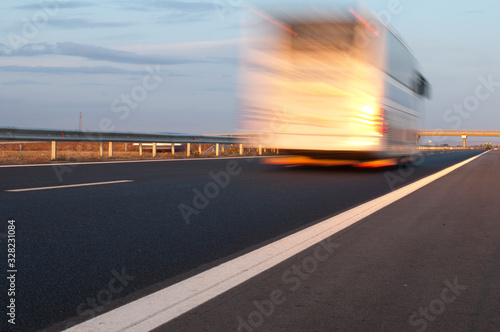 Bus traveling on highway. Motion blur effect
