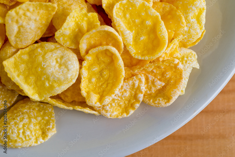 Glazed cornflakes. Breakfast cereals. Background for healthy eating and vegetarianism. Glazed cornflakes. Breakfast cereals. Background for healthy eating and vegetarianism.