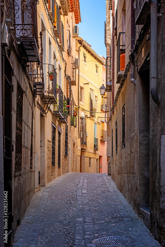 Toledo. Spain. Cozy medieval cobbled narrow street