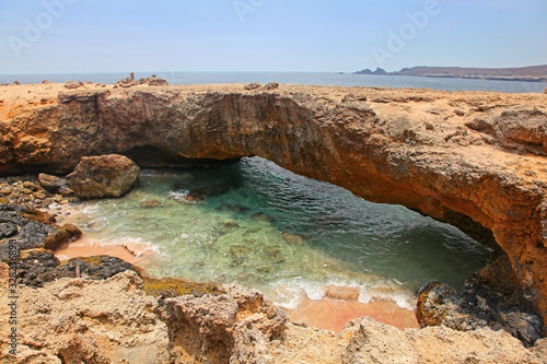 Natural Bridge, that was formed out of coral limestone, Aruba, Lesser Antilies, Caribbean. photo