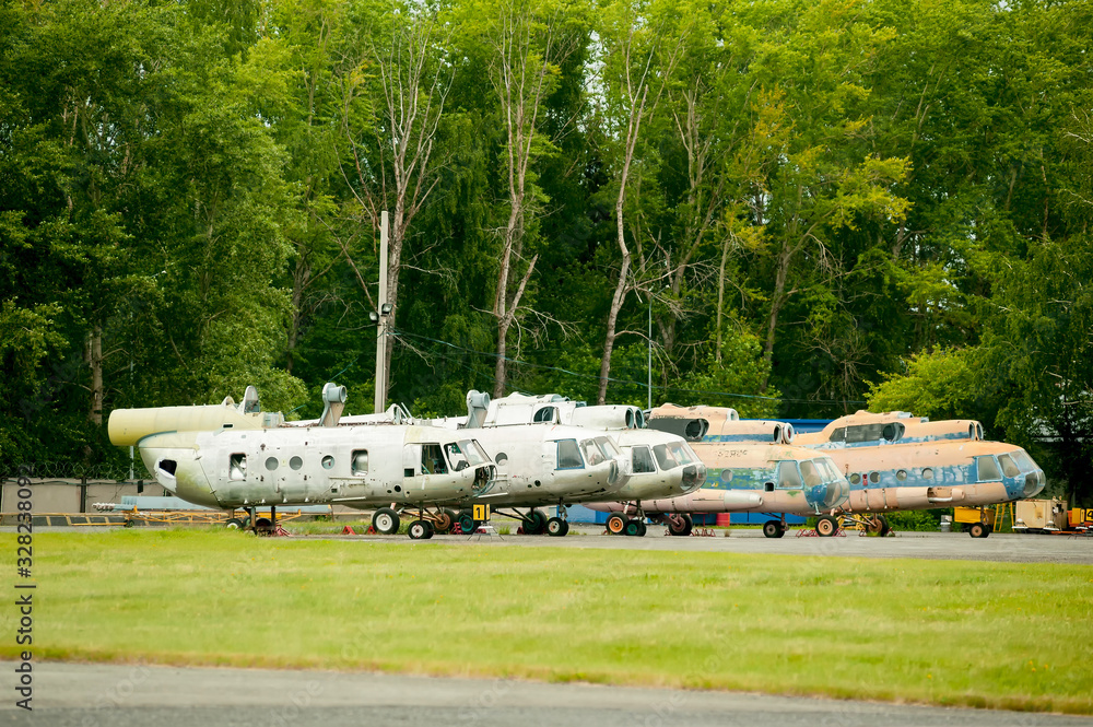 A line of retired old MI-8 helicopters