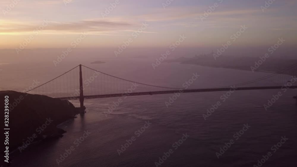 An Impressive And Breathtaking View Of The Famous And Historical Golden Gate Bridge Underneath A Rising Sun At San Francisco California - Aerial Shot An Impressive And Breathtaking View Of The Famous And Historical Golden Gate Bridge Underneath A Rising Sun At San Francisco California - Aerial Shot