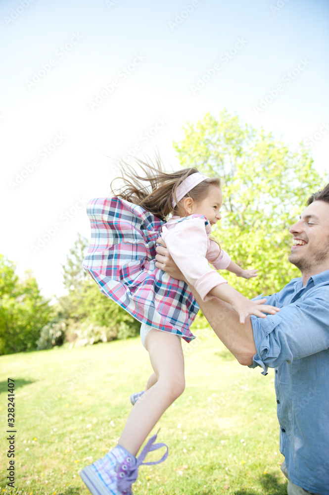 Obraz premium Happy family. Father with child in a park.