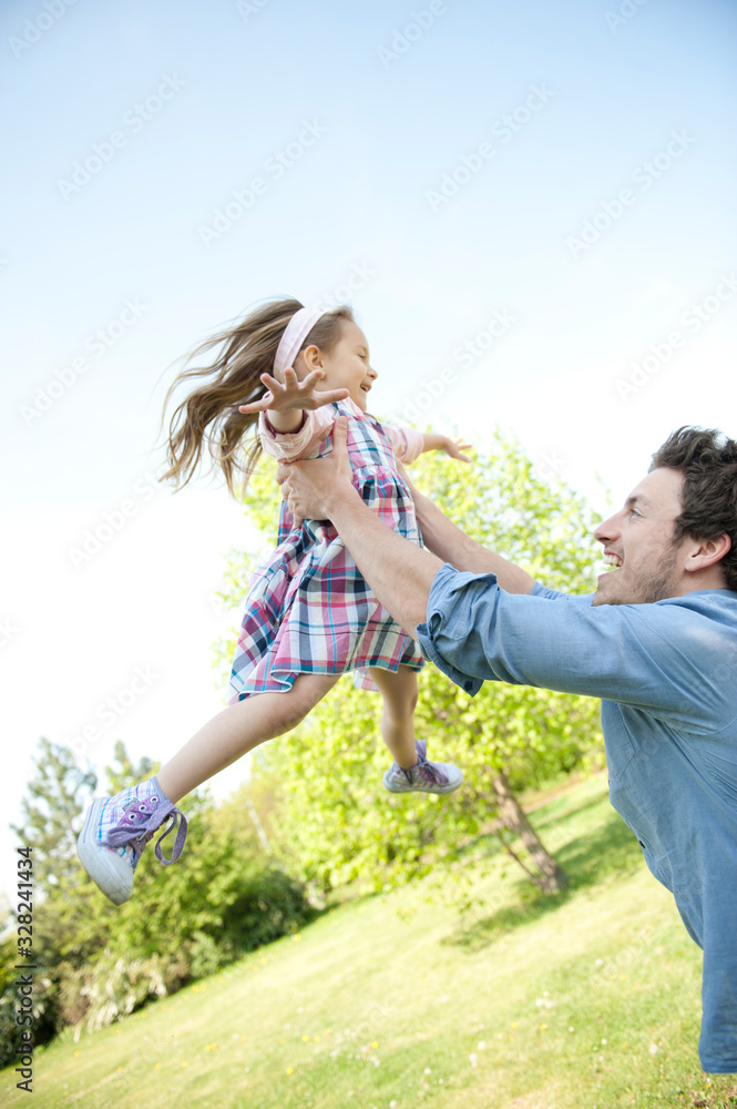 Happy family. Father with child in a park.