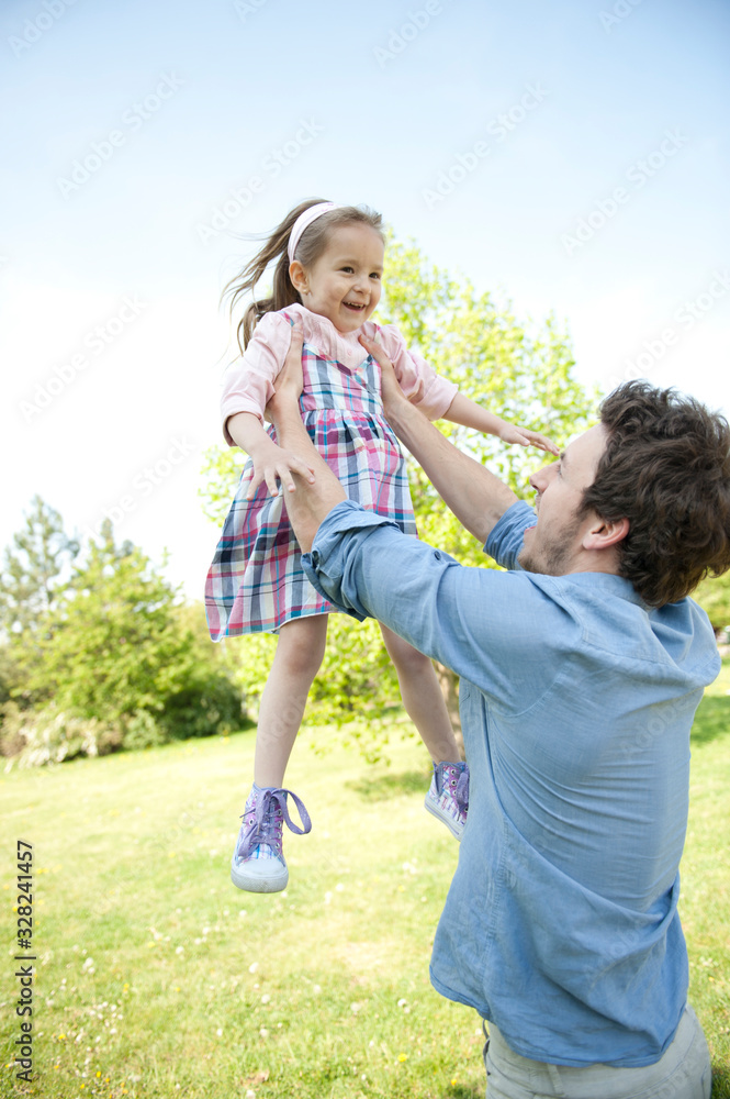 Fototapeta premium Happy family. Father with child in a park.