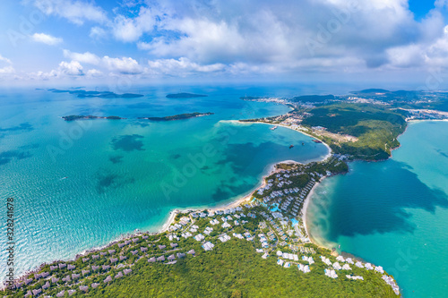 Fototapeta Naklejka Na Ścianę i Meble -  Coastal Resort Scenery of Ong Doi Cape, Emerald Bay, Phu Quoc Island, Vietnam, a Tourism Destination for Summer Vacation in Southeast Asia, with Tropical Climate and Beautiful Landscape. Aerial View.