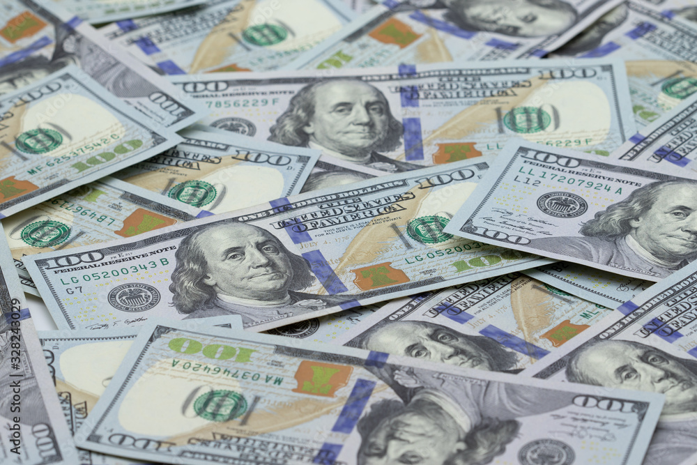 Money background. Hundred US dollar bills. Texture of american currency. Close up of new dollar banknotes Money background. Hundred US dollar bills. Texture of american currency. Close up of new dollar banknotes