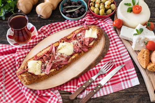 Turkish food pide with sosis sucuk salam and kaşar photo