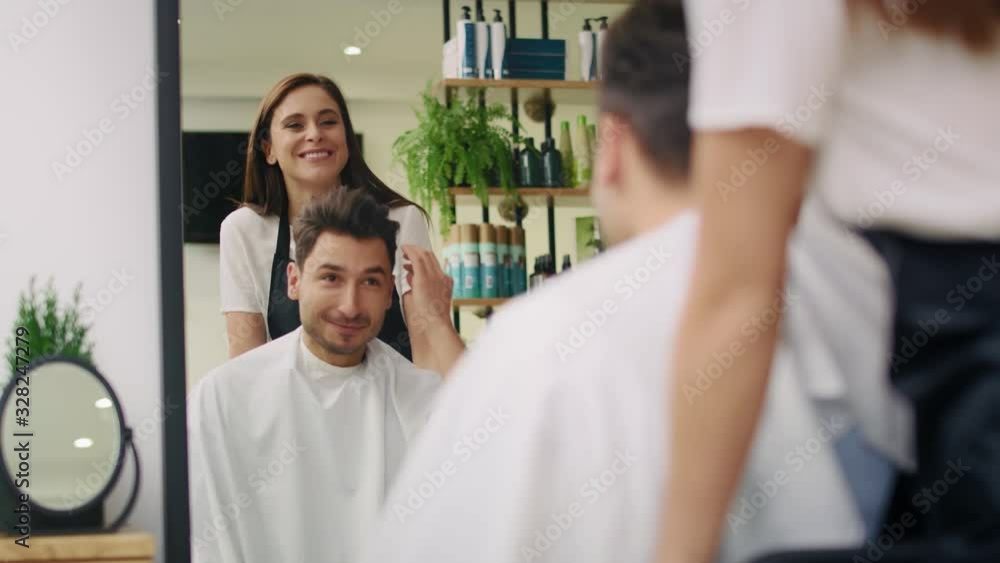Handheld view of hairdresser and customer in hair salon. Shot with RED helium camera in 8K Handheld view of hairdresser and customer in hair salon. Shot with RED helium camera in 8K