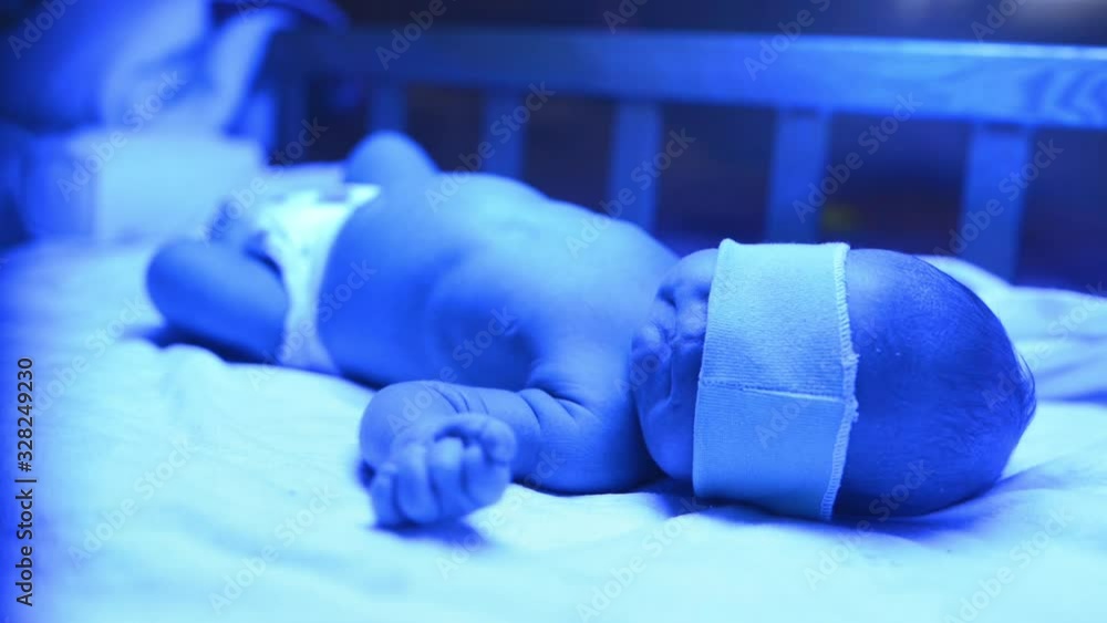 Newborn having a treatment for jaundice under ultraviolet light, Baby