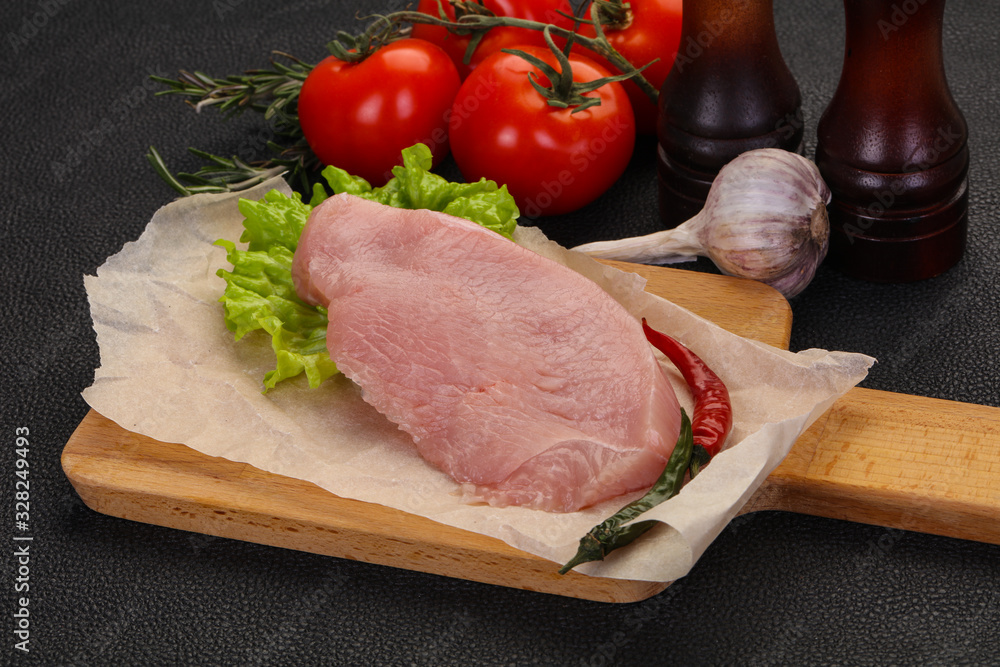 Raw Turkey steak served rosemary Raw Turkey steak served rosemary