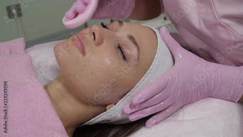 Facial cleansing procedure in a cosmetic clinic.