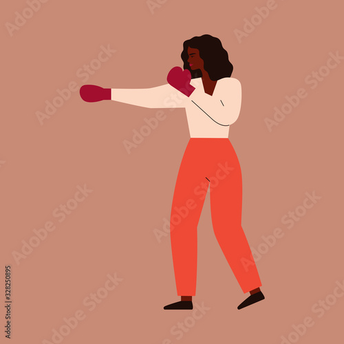 African woman strikes in boxing gloves. Strong Black girl defends himself from external threat. Concept of fight with female discrimination