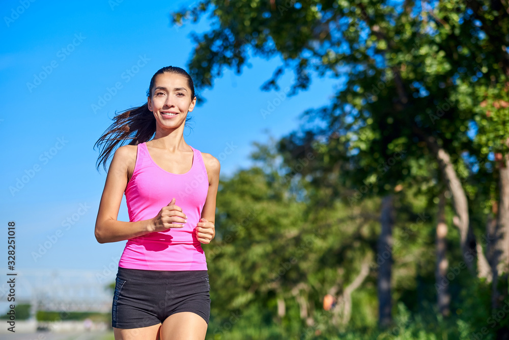 Running woman. Female Runner Jogging during Outdoor Workout in a Park. Beautiful fit Girl. Fitness model outdoors. Weight Loss Running woman. Female Runner Jogging during Outdoor Workout in a Park. Beautiful fit Girl. Fitness model outdoors. Weight Loss