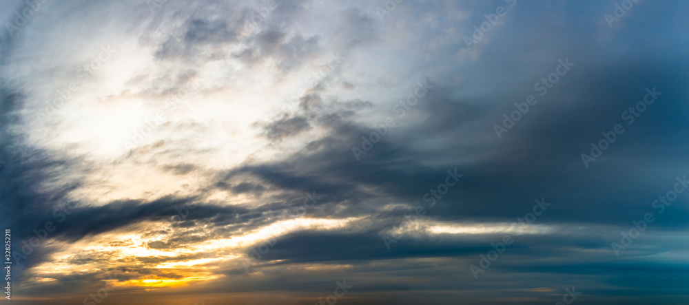 Fantastic dark blue thunderclouds at sunrise, natural composition