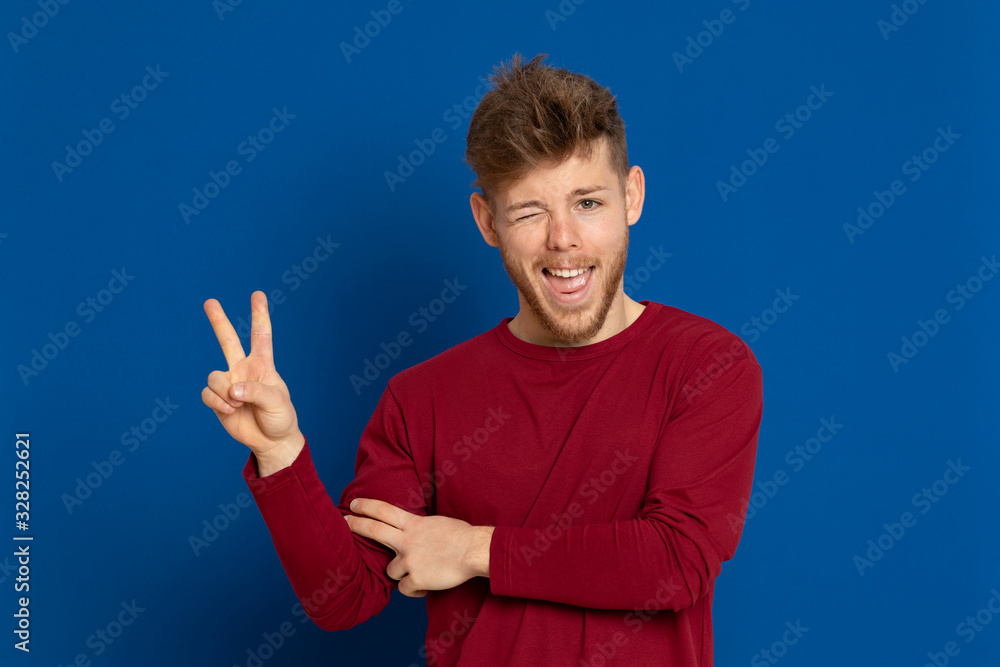 Attractive young guy with a red T-shirt Attractive young guy with a red T-shirt