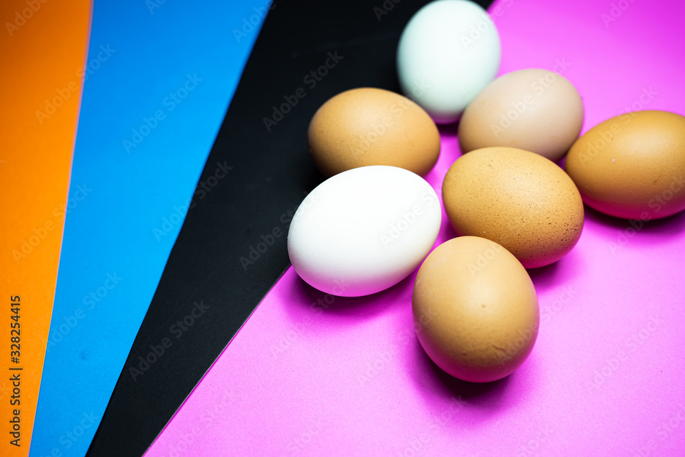 many eggs are in Colorful ( black, blue, pink ) background. Easter Egg Concept and Dark Concept many eggs are in Colorful ( black, blue, pink ) background. Easter Egg Concept and Dark Concept