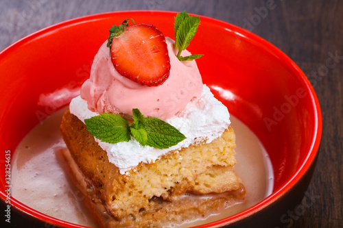 Cake with ice cream served stravberry