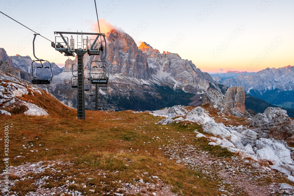 Ski lifts along the ski slope near the Cinque Torri mountains the background Tofane mountain near the famous town of Cortina d'Ampezzo, Dolomites Mountains