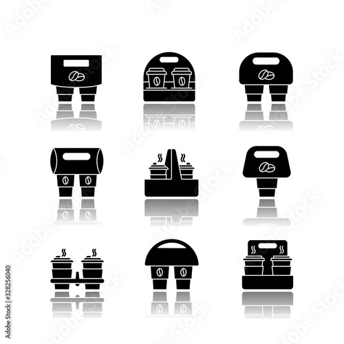 Paper cup holders drop shadow black glyph icons set. Coffee to go packages. Take away hot caffeine drinks. Takeaway cardboard carriers for cups. Isolated vector illustrations on white space