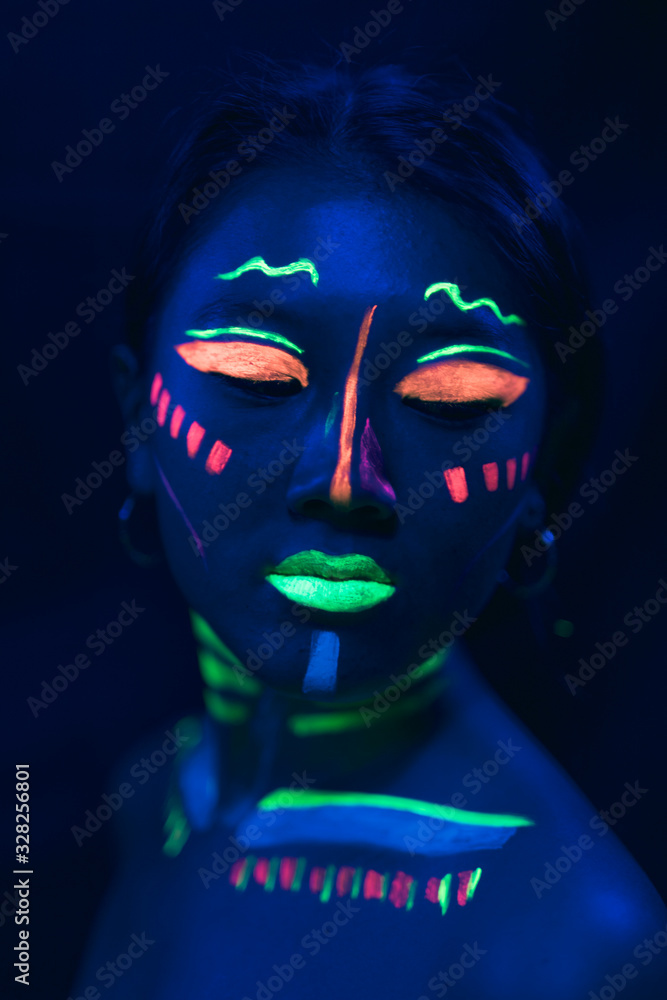 Uv paint make-up on woman's face