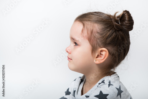 Crying little girl. Upset kid. Sad kid portrait. Cute little girl crying and does not want to go in bed at night
