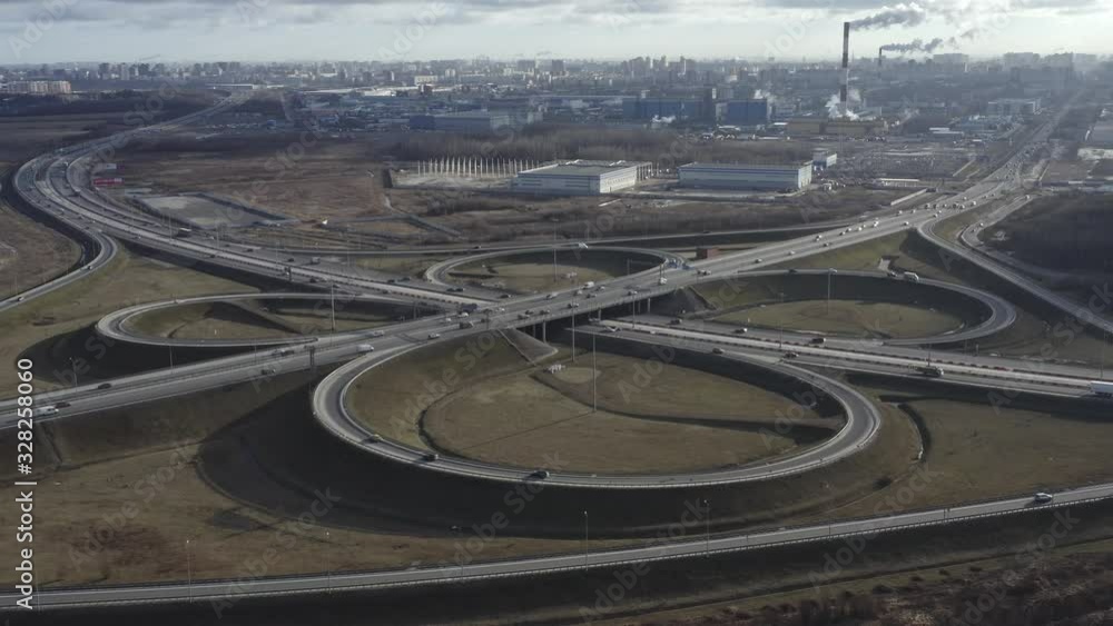 Aerial view road interchange traffic, look as quatrefoil Aerial view road interchange traffic, look as quatrefoil