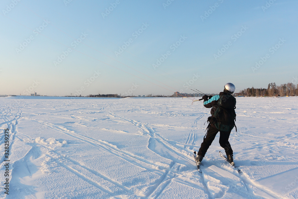 Kiteboarder holding a kite in hands in the winter, Novosibirsk, Russia