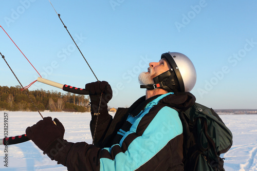 Kiteboarder holding a kite in hands in the winter, Novosibirsk, Russia