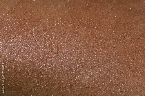 Blended highlighter on skin surface full frame texture.