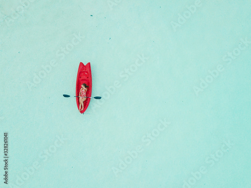 Wallpaper Mural Aerial view of woman kayaking in Bacalar Mexico shot with drone Torontodigital.ca