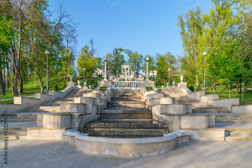 Chisinau, Moldova - View of the Scara Cascadelor landmark in Valea Morilor Park one of the most popular parks in Chisinau, Republic of Moldova on a sunny summer day with blue sky photo