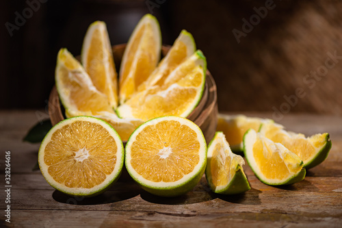 Tableau sur toile Beautiful color of green orange, on the  wooden table indoor