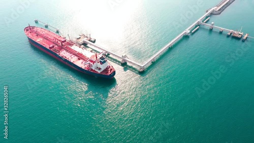 Aerial view oil tanker. Oil loading dock of business logistic sea going ship, Crude oil tanker lpg ngv at industrial estate Thailand / Group Oil tanker ship to Port of Singapore - import export