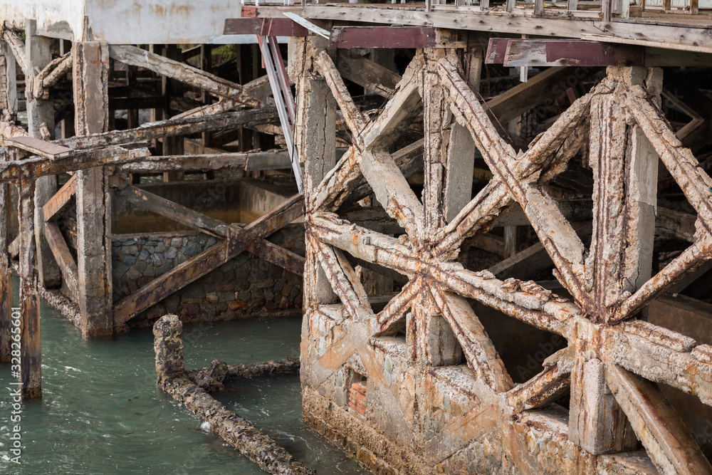 Reinforced concrete have cracked and rusty in steel structure in caused by salt in the sea Reinforced concrete have cracked and rusty in steel structure in caused by salt in the sea