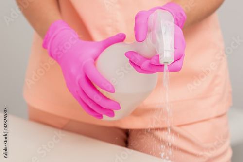 Female hands cleaning table.