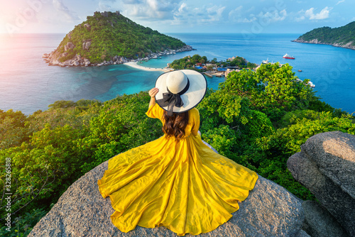 Beautiful girl sitting on viewpoint at Koh Nangyuan island near Koh Tao island, Surat Thaini in Thailand. photo