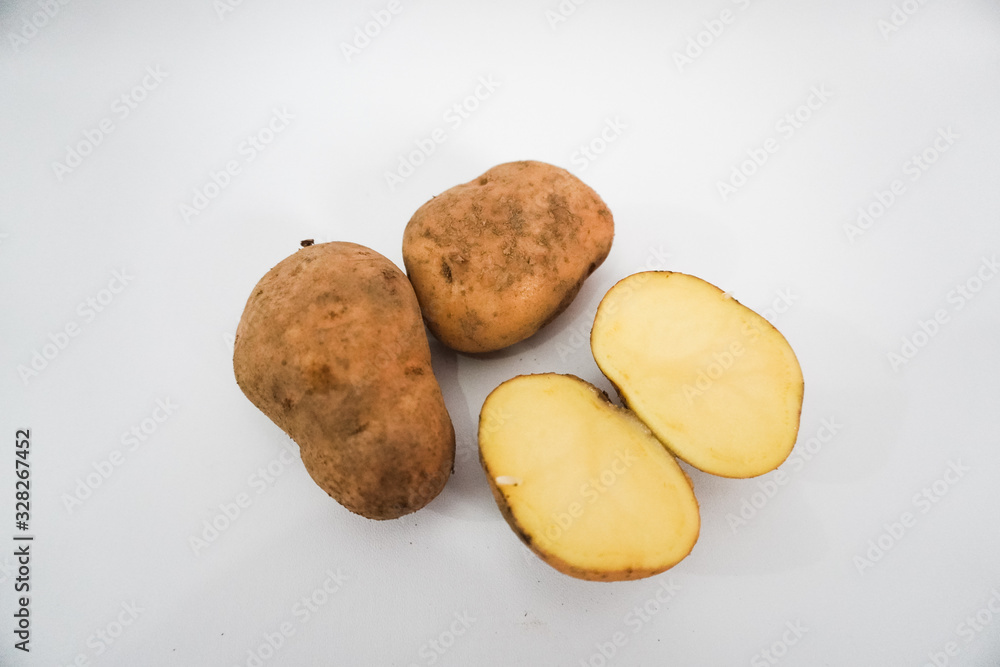 Fototapeta premium Potato vegetables cut on a white background