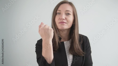 Wallpaper Mural A businesswoman shows a fist. Angry Office Employee, Close Plan Torontodigital.ca