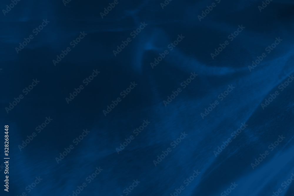 Trendy blue colored low contrast abstract background with light and shadows caustic effect. Light passes through a glass. Water background. 2020 year color trend Trendy blue colored low contrast abstract background with light and shadows caustic effect. Light passes through a glass. Water background. 2020 year color trend