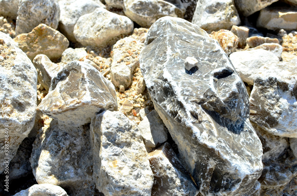 Natural gray gypsum stone. Close up image of stones with black and white. Industrial mining area. Limestone mining, quarry - Image Natural gray gypsum stone. Close up image of stones with black and white. Industrial mining area. Limestone mining, quarry - Image