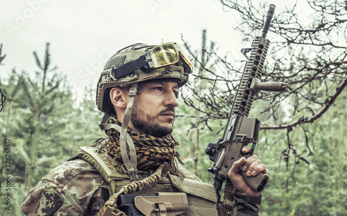 Handsome man in italian military uniform camouflage coloring Digital Vegetato