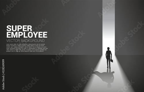 Silhouette of businessman and his shadow of superhero from light of exit way.concept of empower potential and human resource management