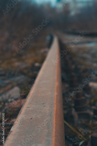 Railway crossing on a cloudy day. Traveling by train. Shallow depth of field © Vladlena