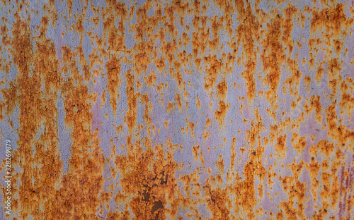 Background in grunge style. Old metal surface with traces of peeling paint and rust